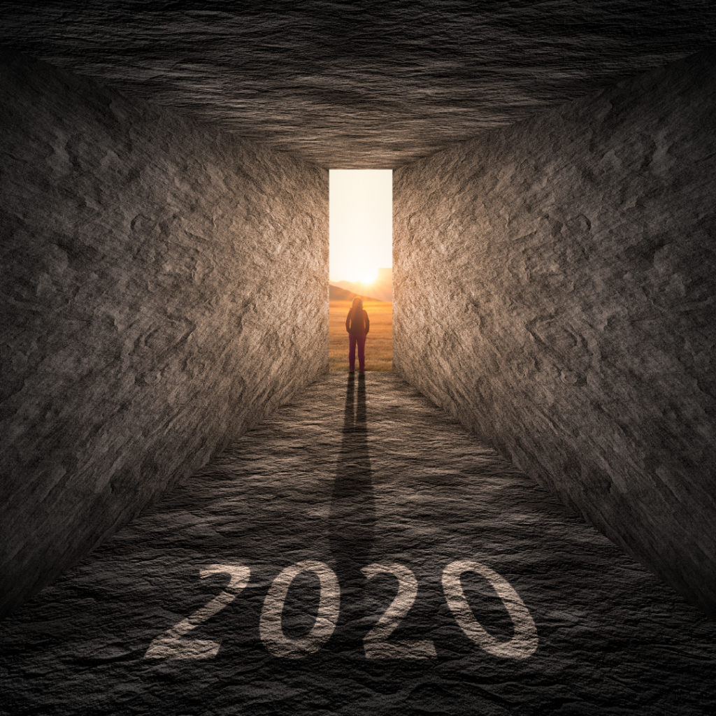 spiritual lessons of 2020 - woman emerging from a dark cave into the light